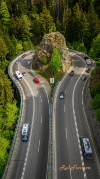 Aerial view of the Autobahn Schwarzwald, Germany, showing a winding road with vehicles.