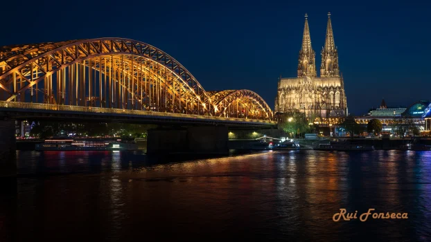 Night view of the Hohenzollern Bridge and Cologne Cathedral, Germany.