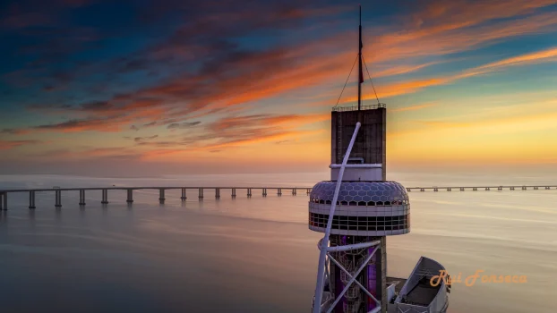 Drone shot of Torre Vasco da Gama and Parque das Nações, Lisbon, Portugal, at sunset.