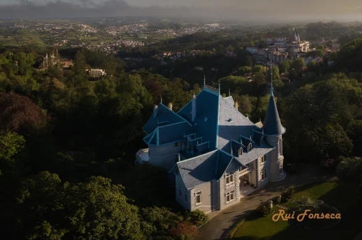 Aerial view of Pena Palace in Sintra, Portugal, at sunrise.